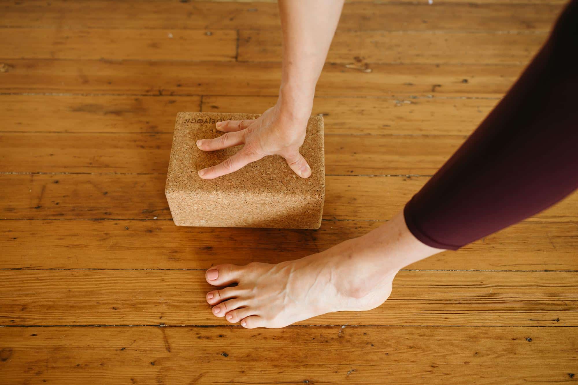 image of a hand on a yoga block